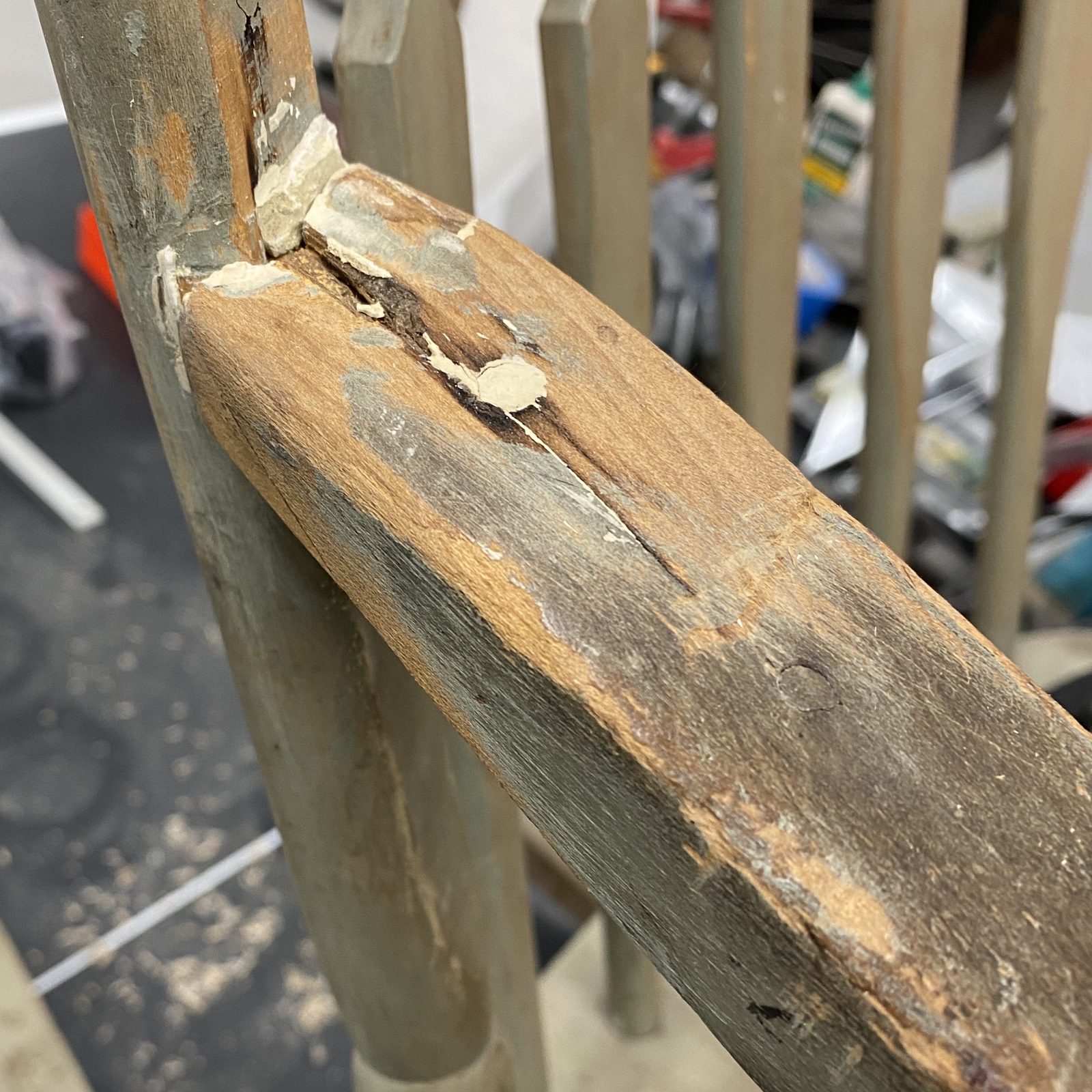 The joint before the 2020 work: bare wood, ghosts of earlier paint, and a plug of plastic wood from one of my father's older campaigns. January 2020.
