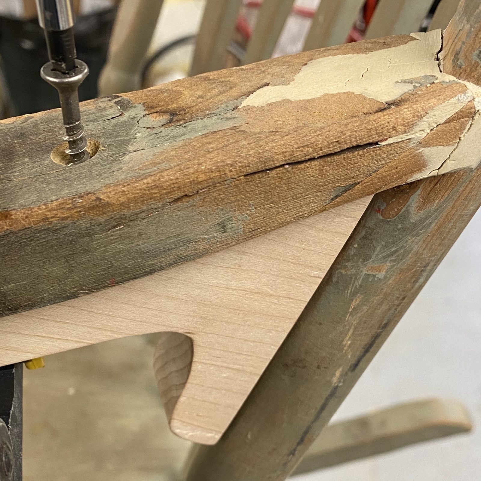 Fitting the maple bracket with a black-oxide wood screw, left exposed. January 2020.