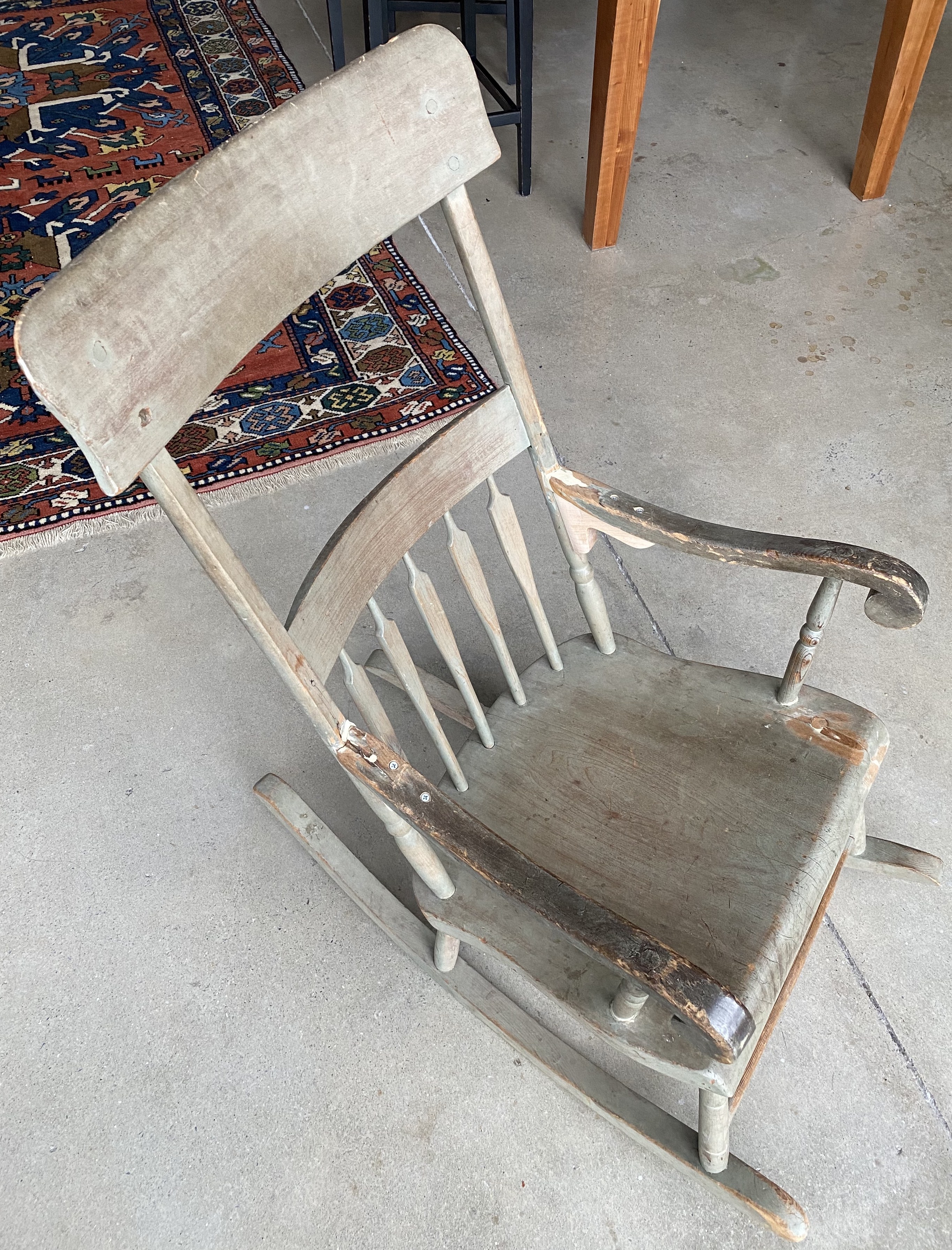 The gray rocker, about a century old, six dollars at the start, and a lifetime of repairs since. Photographed 2020.