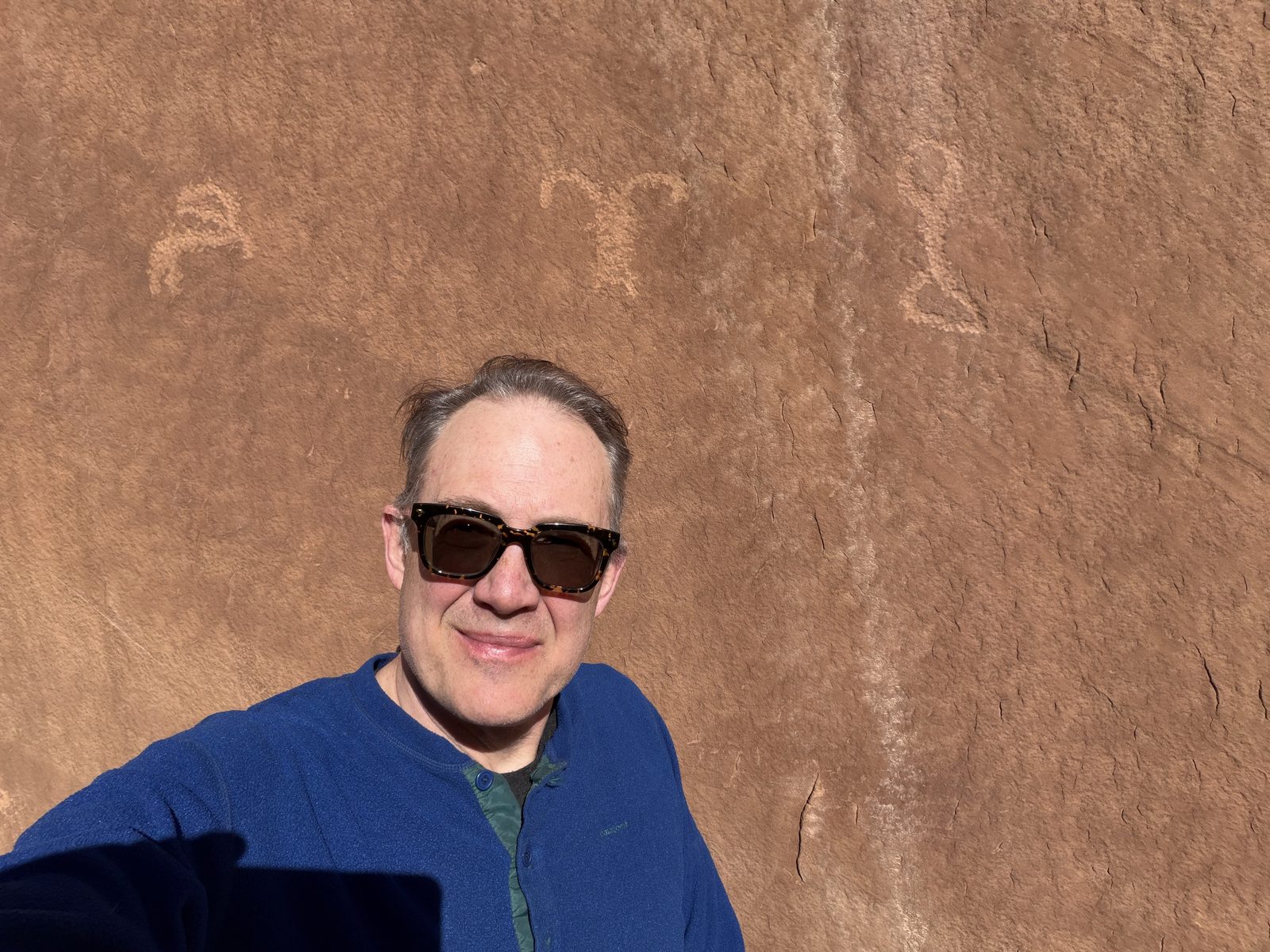 Me, and the marks pecked into Navajo sandstone somewhere on the Swell, older than the Fremont who farmed this country later. I leave the location off on purpose, the way you learn to.