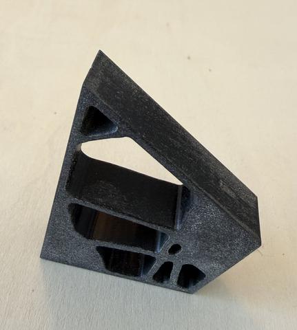 The bone bracket: a printed corner block that keeps only the material the loads use.