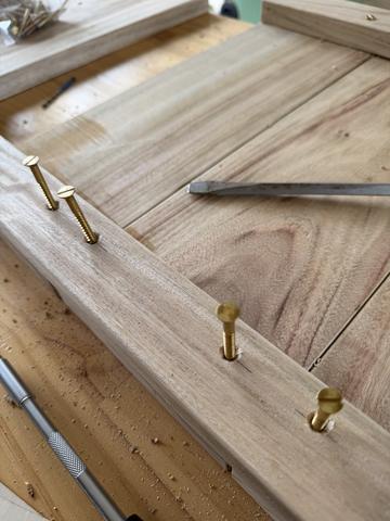 Trial fit of brass wood screws.