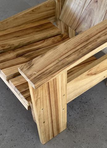 The hardwood crate chair: corner detail, screws displayed, nothing hidden.