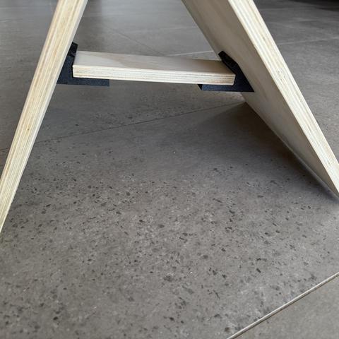 The batten seats in printed saddles: position by bracket, load by wood.