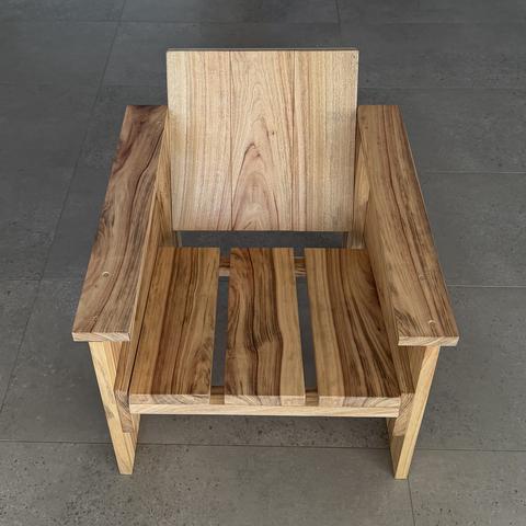 The hardwood crate chair, front on.