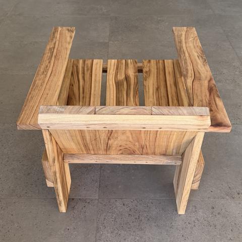 The hardwood crate chair from behind.