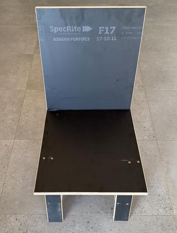 K2 in branded form ply, front elevation. The stencil stays: the material is the provenance.