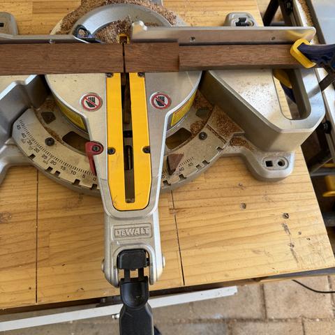 Chopping the ripped strip into cleats. Stop set at 75mm, the width of the staves.