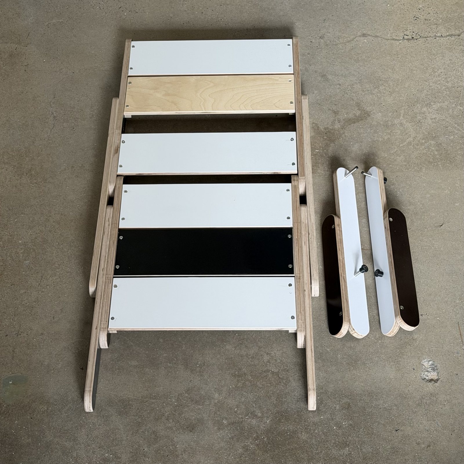 The Keel Truss chair knocked down, panels and sticks laid out