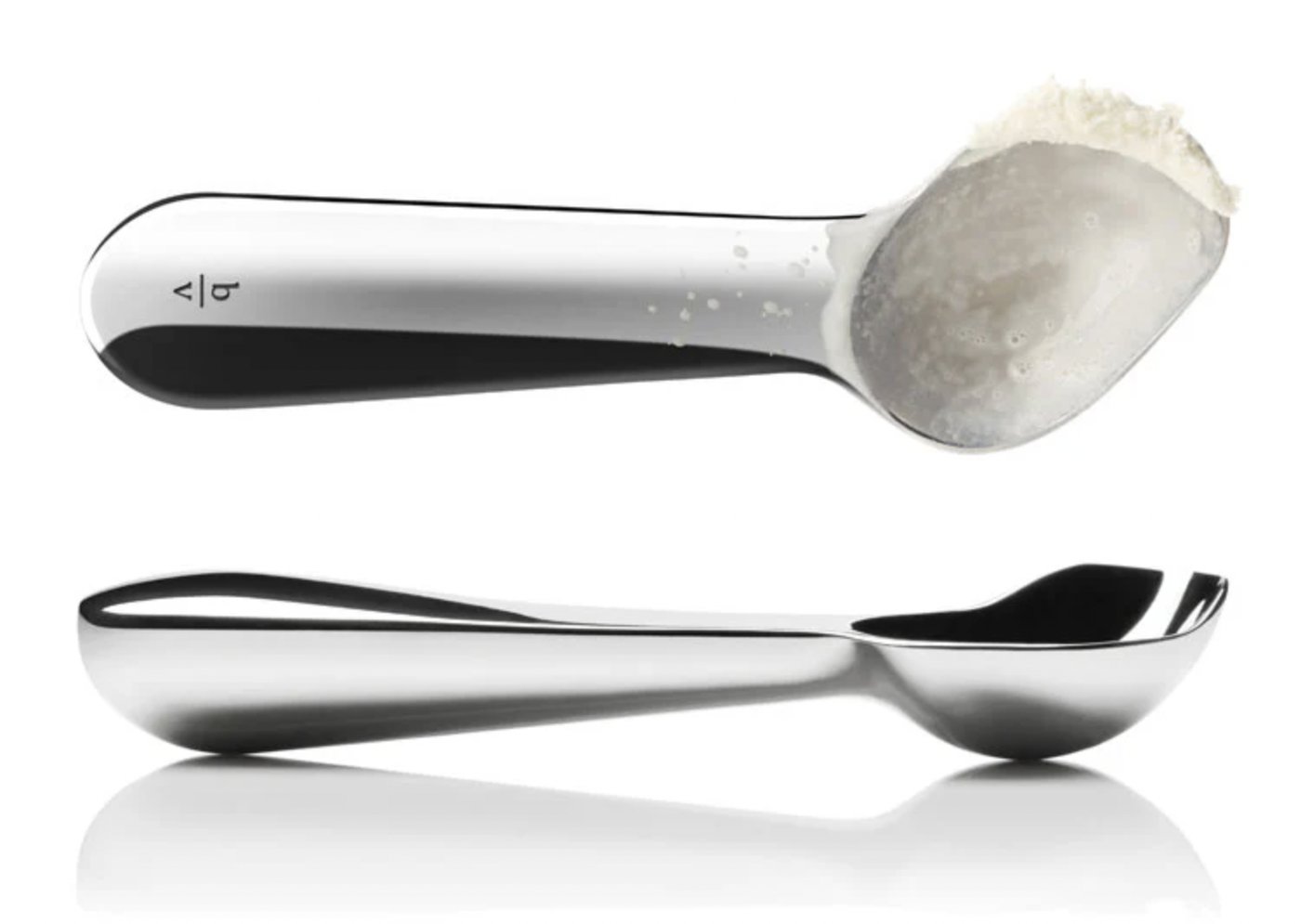 The Belle-V scoop. I invented the angle and the heat-conducting mass and proved the ergonomics; the designers at Lunar gave it the form. Two patents, one for each pair of hands. The small b over v is the only thing on it I would call a signature.