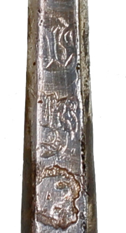 A close view of struck English silver hallmarks.