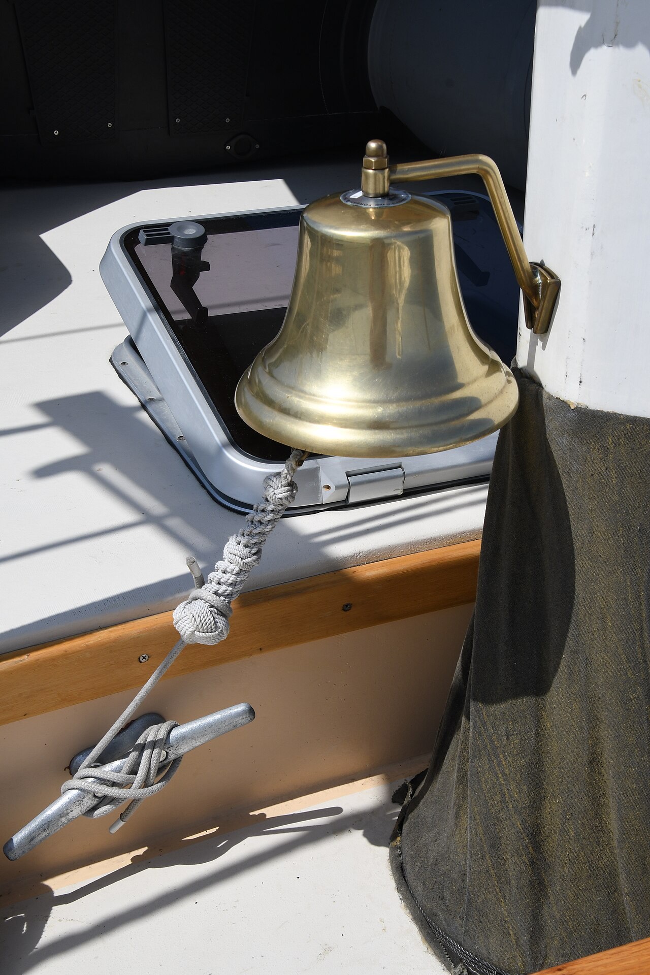 A ship's bell on deck.